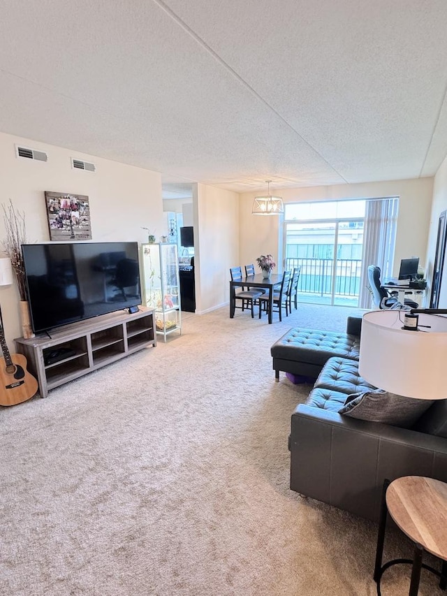 656 Pearson St Unit 512C, Des Plaines, IL 60016 - carpeted living room featuring a textured ceiling