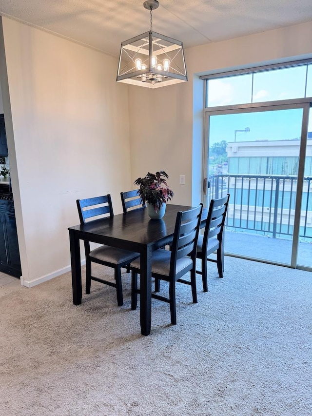 656 Pearson St Unit 512C, Des Plaines, IL 60016 - dining area featuring carpet and a chandelier