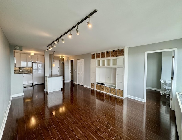 1850 N Clark St Unit 2406, Chicago, IL 60614 - unfurnished living room featuring dark wood finished floors and rail lighting