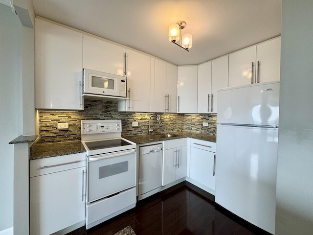 1850 N Clark St Unit 2406, Chicago, IL 60614 - kitchen featuring white appliances, dark stone counters, dark wood finished floors, and backsplash