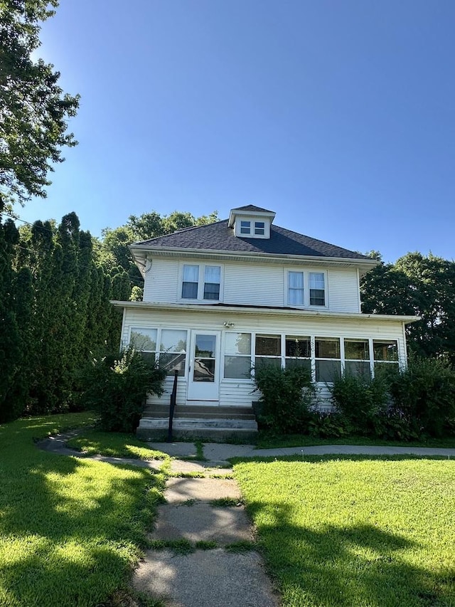605 Washington St, Prophetstown, IL 61277 - american foursquare style home featuring a front lawn and entry steps