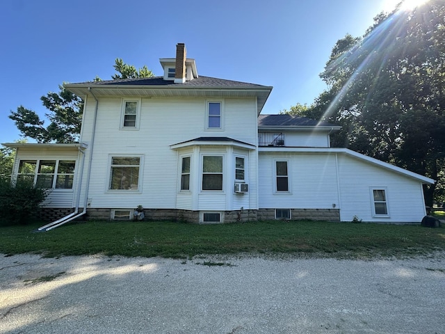 605 Washington St, Prophetstown, IL 61277 - back of property featuring a chimney and cooling unit