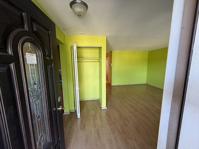 5925 W Montrose Ave Unit 3C, Chicago, IL 60634 - hallway featuring wood finished floors and baseboards
