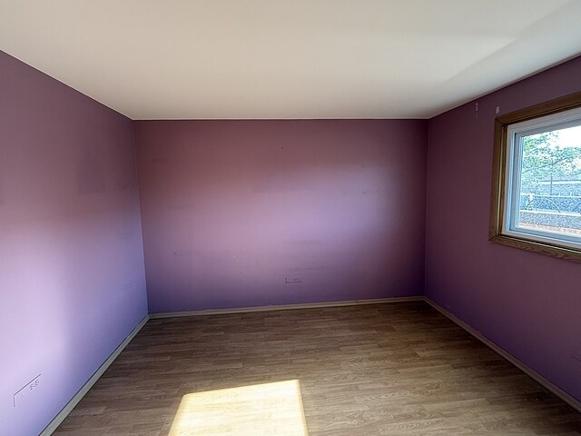 5925 W Montrose Ave Unit 3C, Chicago, IL 60634 - unfurnished room with wood finished floors