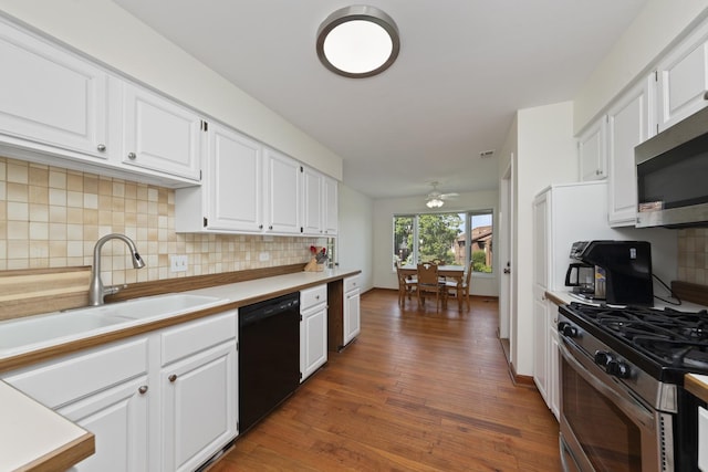 12912 Mill Dr E Unit B2, Palos Park, IL 60464 - kitchen with stainless steel appliances, wood finished floors, white cabinetry, and light countertops