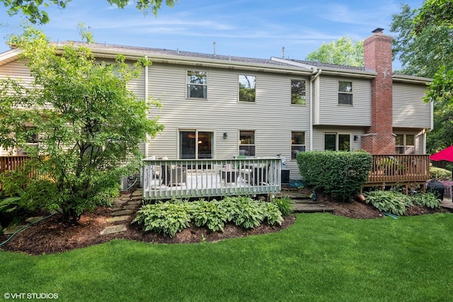 202 Woodboro Dr, West Chicago, IL 60185 - rear view of property featuring a deck, a chimney, and a lawn