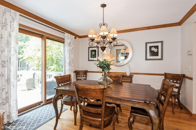 202 Woodboro Dr, West Chicago, IL 60185 - dining area featuring a chandelier, light wood-type flooring, and ornamental molding