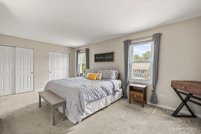 218 Foxmoor Rd, Fox River Grove, IL 60021 - carpeted bedroom featuring two closets and baseboards