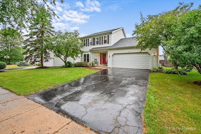 218 Foxmoor Rd, Fox River Grove, IL 60021 - view of front of property with a garage, asphalt driveway, and a front yard