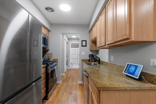 1415 W Lunt Ave Unit 402, Chicago, IL 60626 - kitchen with stainless steel appliances, light wood-type flooring, and light stone counters
