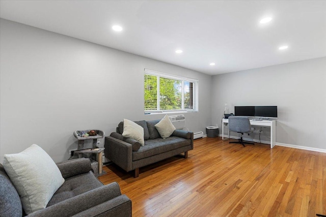 1415 W Lunt Ave Unit 402, Chicago, IL 60626 - living room with light wood finished floors, recessed lighting, a baseboard radiator, and a wall mounted AC