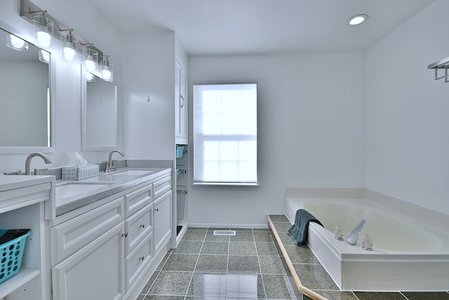 2020 Medinah Cir, Elgin, IL 60123 - bathroom featuring double vanity, a garden tub, and recessed lighting