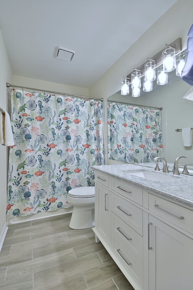 2020 Medinah Cir, Elgin, IL 60123 - bathroom with vanity, wood finish floors, and a shower with shower curtain