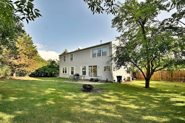 2020 Medinah Cir, Elgin, IL 60123 - rear view of property featuring an outdoor fire pit and a patio