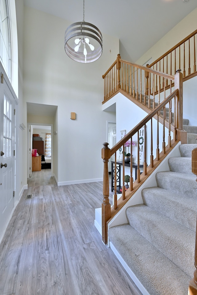 2020 Medinah Cir, Elgin, IL 60123 - foyer with a high ceiling, wood finished floors, and stairs