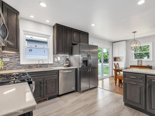 3916 N Adams St, Westmont, IL 60559 - kitchen featuring stainless steel appliances, light countertops, decorative backsplash, and recessed lighting