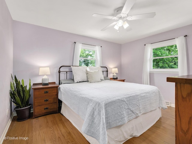 3916 N Adams St, Westmont, IL 60559 - bedroom with light wood-style floors and a ceiling fan