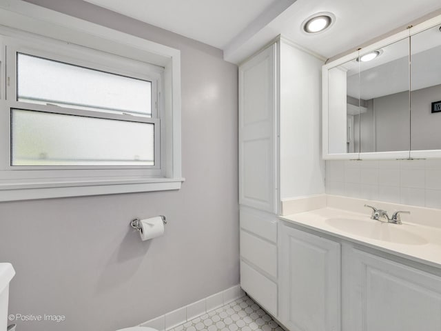 3916 N Adams St, Westmont, IL 60559 - bathroom featuring vanity and tasteful backsplash