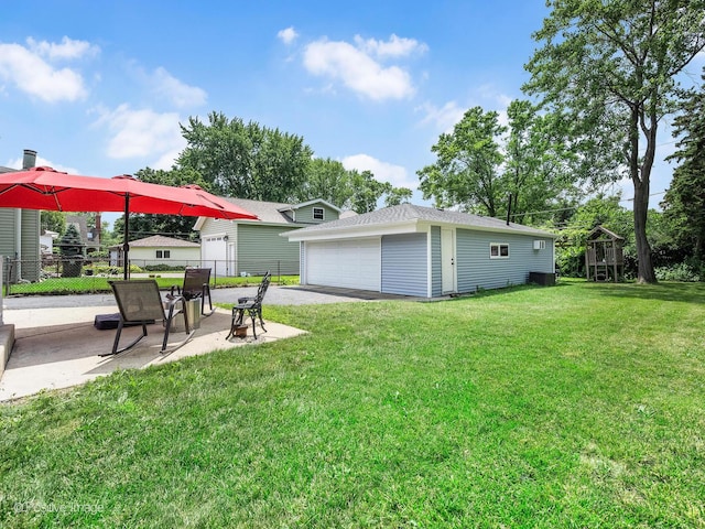 3916 N Adams St, Westmont, IL 60559 - view of yard featuring a detached garage and a patio area