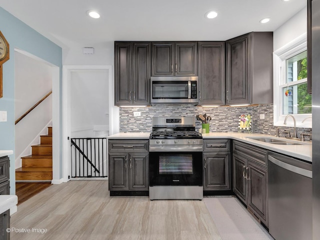 3916 N Adams St, Westmont, IL 60559 - kitchen with stainless steel appliances, light countertops, decorative backsplash, and recessed lighting