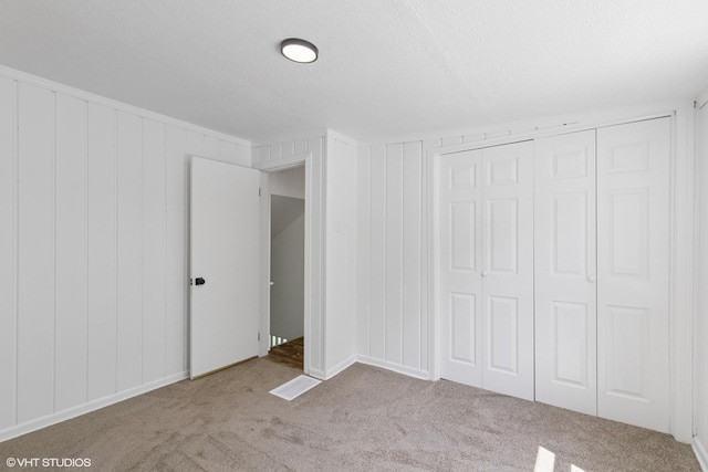 14449 Kenton Ave, Midlothian, IL 60445 - unfurnished bedroom featuring carpet floors, a closet, and a textured ceiling