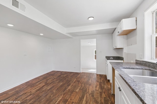 14449 Kenton Ave, Midlothian, IL 60445 - kitchen with dark wood-style floors, stone counters, white cabinets, and recessed lighting