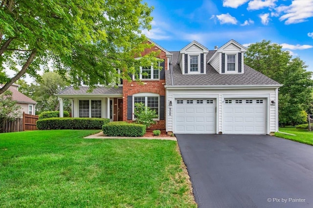 906 Ridgewood Dr, Cary, IL 60013 - view of front of house featuring driveway, a garage, and roof with shingles