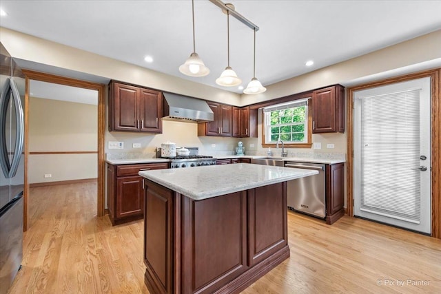 906 Ridgewood Dr, Cary, IL 60013 - kitchen with stainless steel appliances, wall chimney range hood, light wood-style flooring, pendant lighting, and recessed lighting