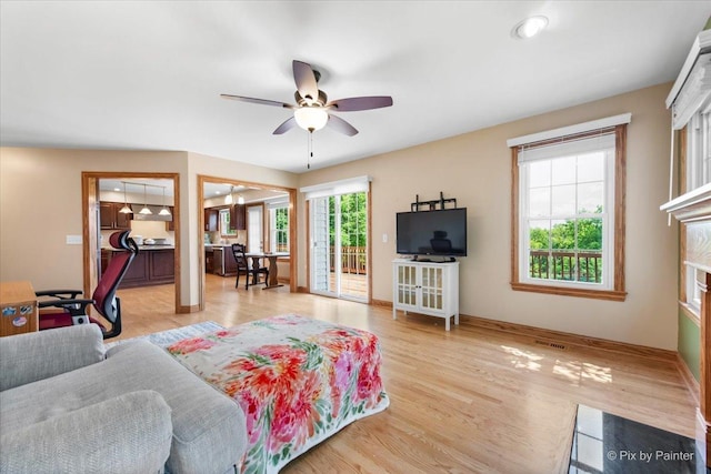 906 Ridgewood Dr, Cary, IL 60013 - living room with ceiling fan and light wood-style flooring