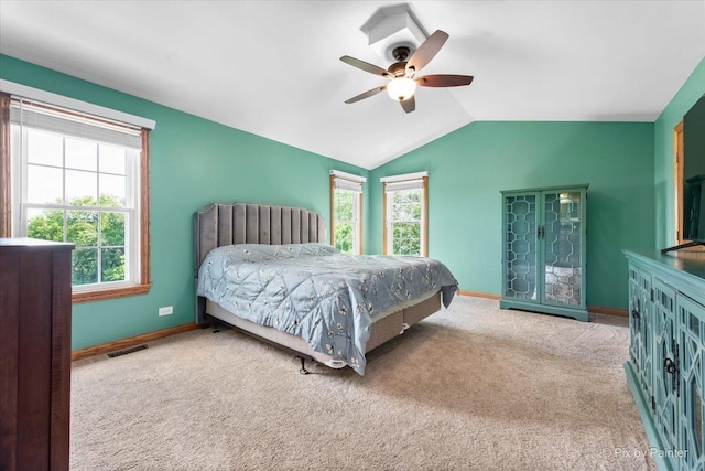 906 Ridgewood Dr, Cary, IL 60013 - carpeted bedroom featuring multiple windows, vaulted ceiling, and ceiling fan