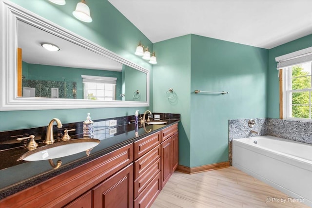 906 Ridgewood Dr, Cary, IL 60013 - bathroom with double vanity, a bath, and tiled shower