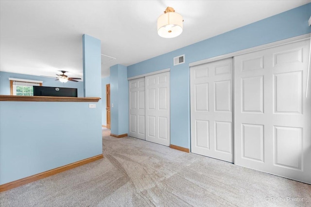 906 Ridgewood Dr, Cary, IL 60013 - unfurnished bedroom with two closets and carpet