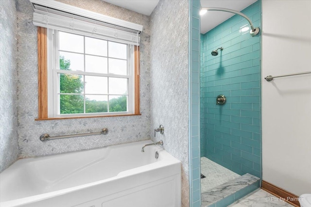 906 Ridgewood Dr, Cary, IL 60013 - bathroom featuring healthy amount of natural light, a garden tub, tiled shower, and marble look tiles