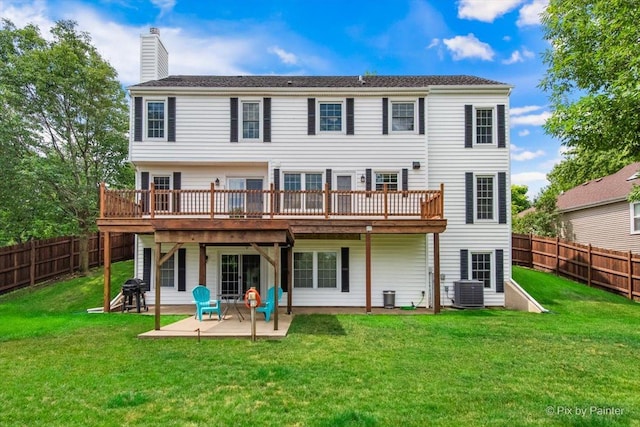 906 Ridgewood Dr, Cary, IL 60013 - rear view of property featuring a deck, a chimney, a patio, and a fenced backyard