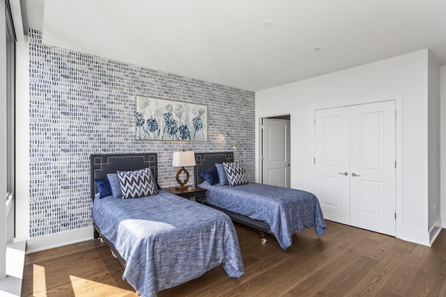 363 E Wacker Dr Unit 2503, Chicago, IL 60601 - bedroom featuring an accent wall, wood finished floors, and a closet