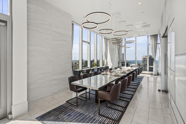 363 E Wacker Dr Unit 2503, Chicago, IL 60601 - dining room featuring a wall of windows, a view of city, and light tile patterned flooring