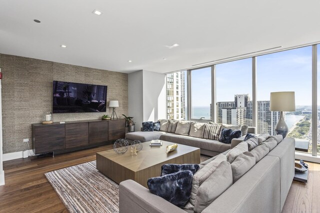 363 E Wacker Dr Unit 2503, Chicago, IL 60601 - living room featuring dark wood-style floors, floor to ceiling windows, recessed lighting, and an accent wall