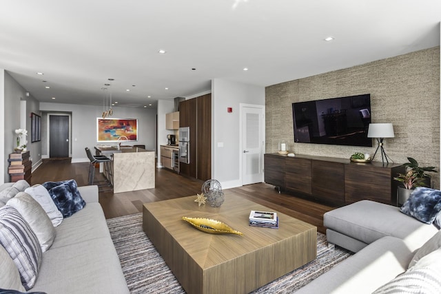 363 E Wacker Dr Unit 2503, Chicago, IL 60601 - living room featuring dark wood-style flooring, recessed lighting, and an accent wall