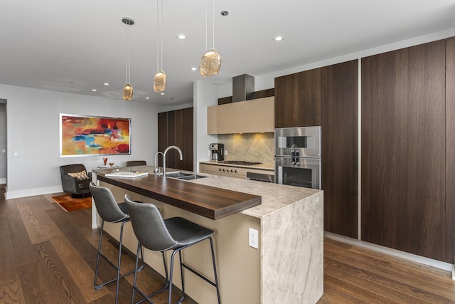 363 E Wacker Dr Unit 2503, Chicago, IL 60601 - kitchen featuring a center island with sink, dark wood-style flooring, recessed lighting, a kitchen breakfast bar, and modern cabinets