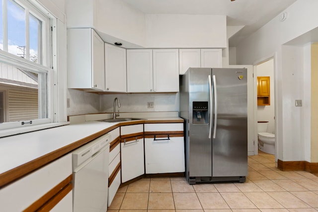 2326 Hancock St, Rockford, IL 61103 - kitchen featuring stainless steel refrigerator with ice dispenser, dishwasher, white cabinetry, and light countertops