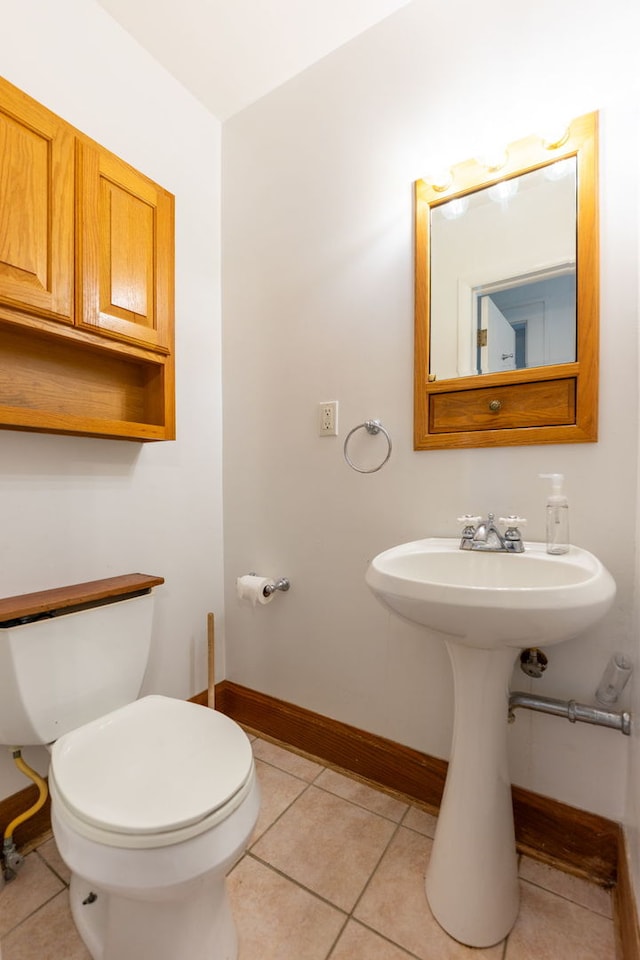 2326 Hancock St, Rockford, IL 61103 - half bath featuring tile patterned floors and toilet