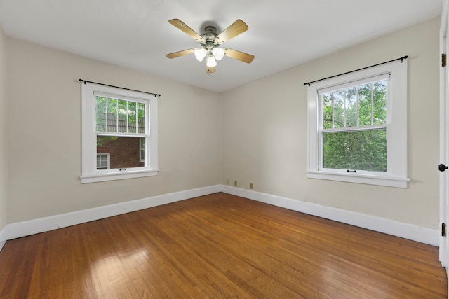 2326 Hancock St, Rockford, IL 61103 - empty room with healthy amount of natural light, wood finished floors, and ceiling fan