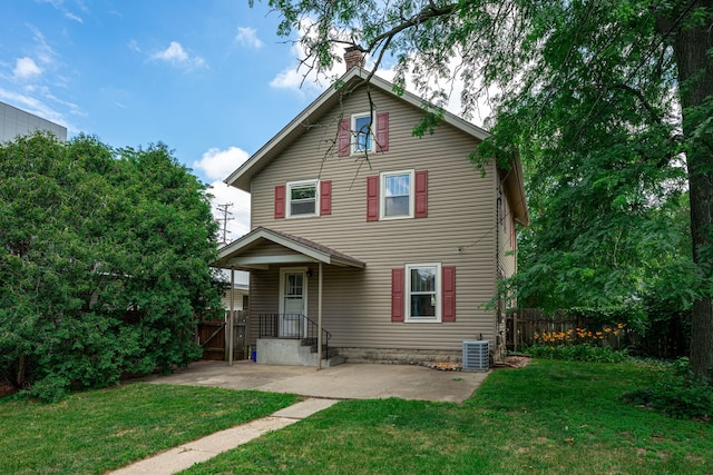 2326 Hancock St, Rockford, IL 61103 - view of front of home with a chimney and a patio