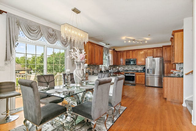 1285 Mallard Ln, Hoffman Estates, IL 60192 - dining area featuring a chandelier and light wood-style floors