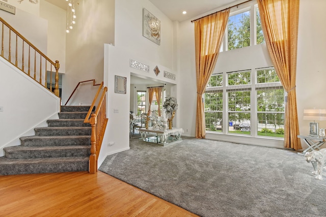 1285 Mallard Ln, Hoffman Estates, IL 60192 - entryway with a high ceiling, stairs, wood finished floors, and carpet