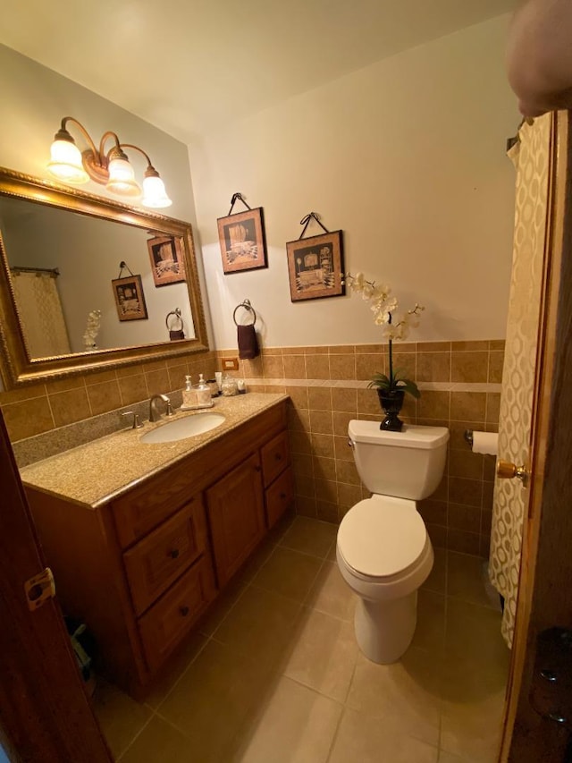 1601 Cherokee Dr, Round Lake Beach, IL 60073 - bathroom with vanity, tile patterned flooring, a wainscoted wall, and tile walls