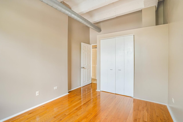 5200 S Ellis Ave Unit 318, Chicago, IL 60615 - unfurnished bedroom with light wood-style flooring and a closet
