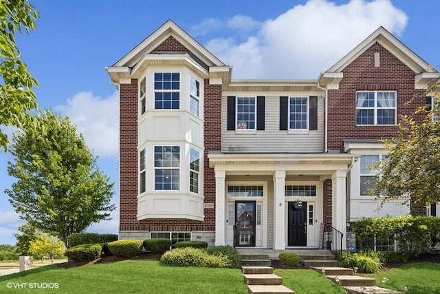 10589 153rd Pl, Orland Park, IL 60462 - view of front facade with a front yard and brick siding