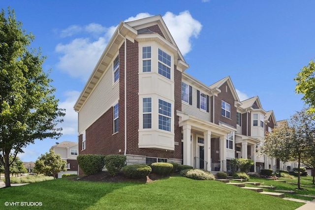 10589 153rd Pl, Orland Park, IL 60462 - view of front facade with brick siding and a front yard