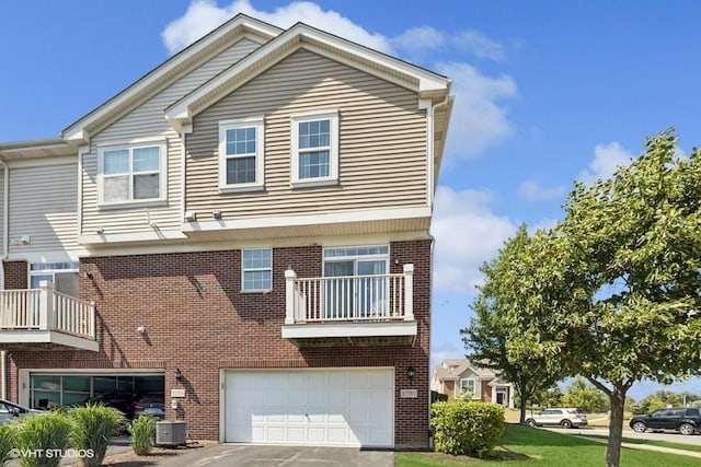 10589 153rd Pl, Orland Park, IL 60462 - traditional home with brick siding, a garage, a balcony, and driveway